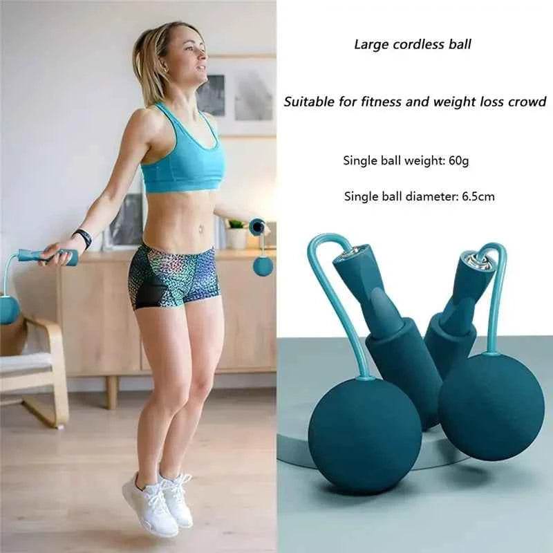 Woman using cordless jump rope fitness with large cordless ball for effective workout and weight loss