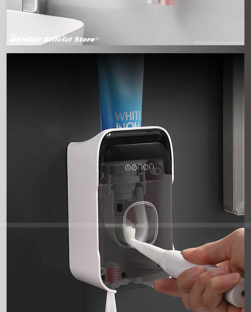 Fitzsi Essentials hands-free toothpaste dispenser mounted on a wall with a toothbrush in use