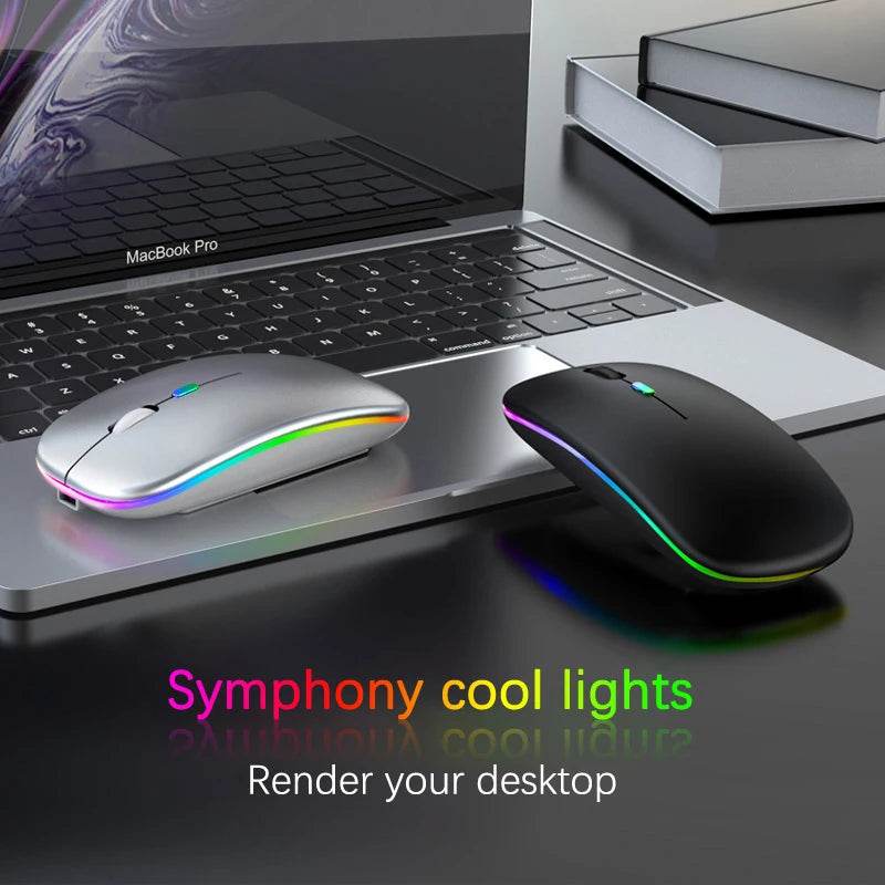 Rechargeable Bluetooth wireless mouse in sleek design with cool lights next to a MacBook Pro
