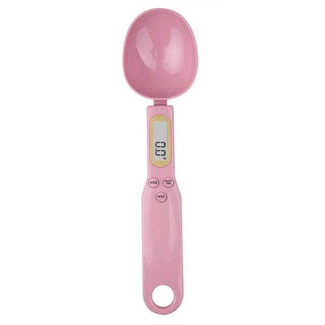 Pink electronic measuring spoon with digital display and easy-to-use buttons for precise measurements