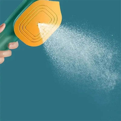 Fitzsi Essentials handheld garment steamer releasing a fine mist for effective wrinkle removal
