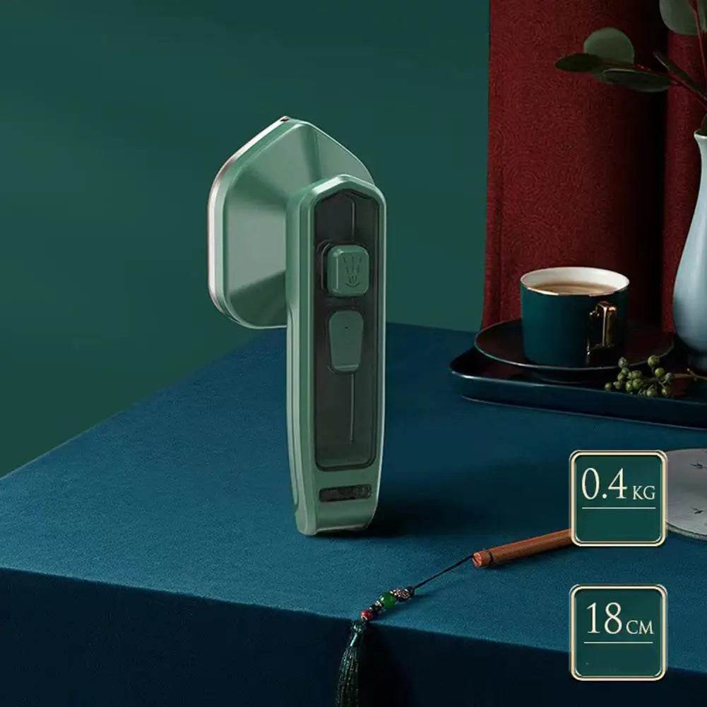 Fitzsi Essentials handheld garment steamer in green with easy controls for wrinkle-free clothing